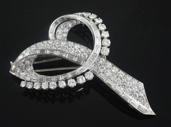 A French 18ct white gold and diamond scroll brooch 65mm.